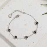 צמיד טייני לב בלינג שחור